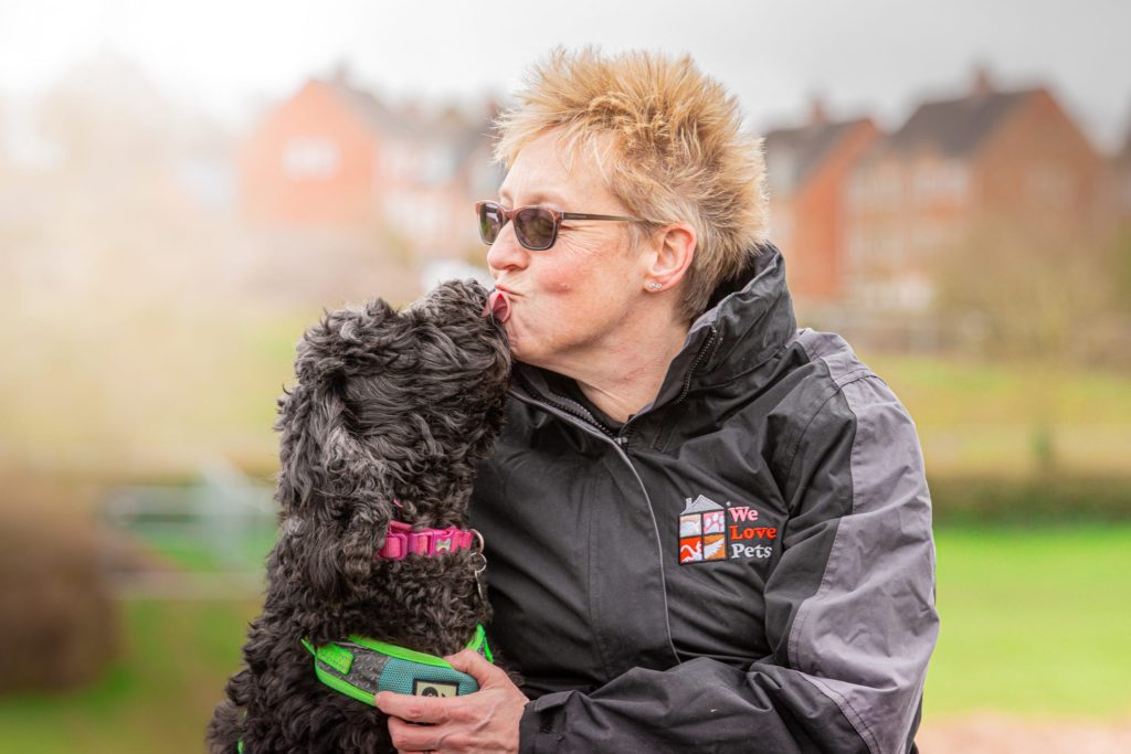 Viv from We Love Pets Telford kissing a dog