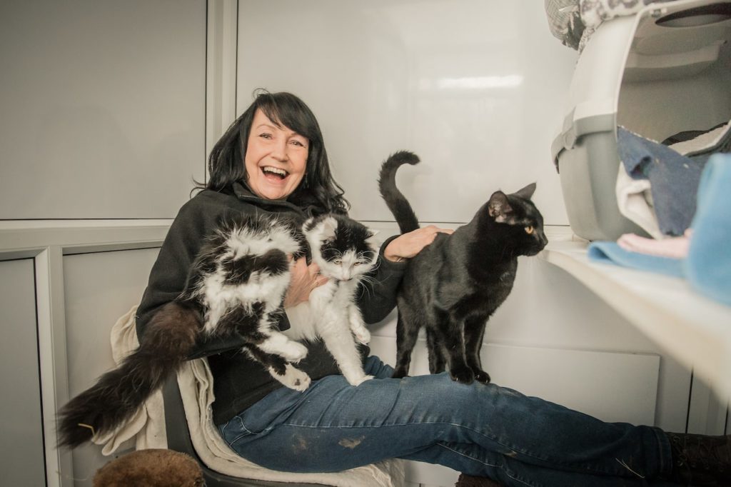 Andrea with two cats