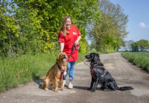 Catherine managing a small group of dogs during a safe pack walking session
