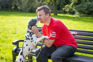 Dog interacting with Jake East Coast during an outdoor enrichment session
