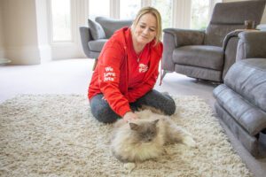 We Love Pets pet sitter caring for a cat in the owner's home