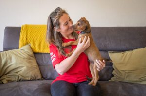 We Love Pets franchisee giving a dog a cuddle